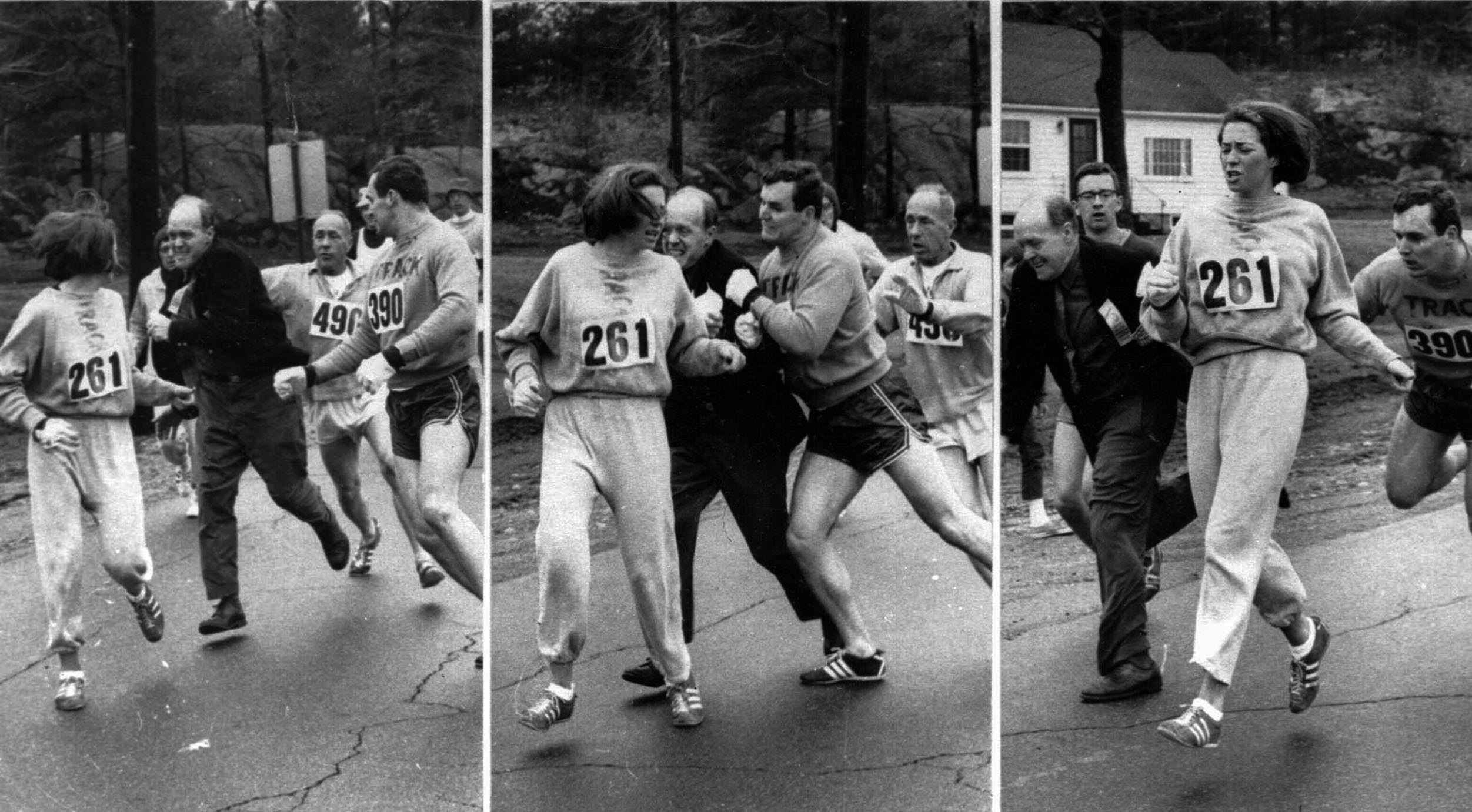 A woman, listed only as K. Switzer of Syracuse, found herself about to be thrown out of the normally all-male Boston Marathon when a husky companion, Thomas Miller of Syracuse, threw a block that tossed a race official out of the running instead, April 19, 1967 in Hopkinton, Mass.(AP PHOTO)